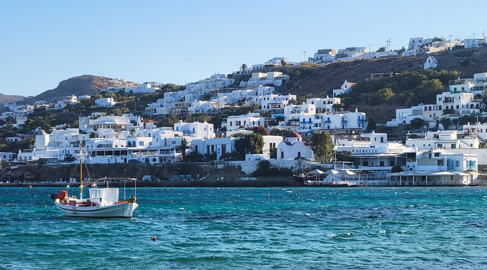 Small boat on calm Aegean water off Mykonos